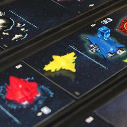 In the Battle of Kemble's Cascade, from Z-Man Games, two to five players navigate their spaceships through a scrolling stream of space cards, many containing dangers like enemies and asteroids.  