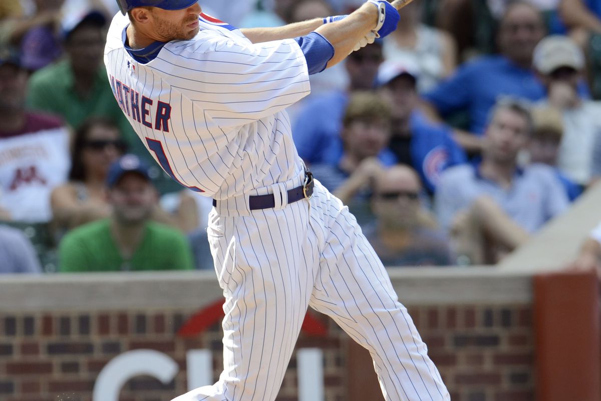 Chicago, IL, USA; Chicago Cubs outfielder Joe Mather hits a RBI single against the Colorado Rockies at Wrigley Field. Credit: Jerry Lai-US PRESSWIRE