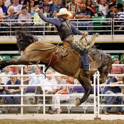 Taos Muncy rides his re-ride in the Days of 47 Rodeo Wednesday, July 23, 2014, at EnergySolutions Arena in Salt Lake City.