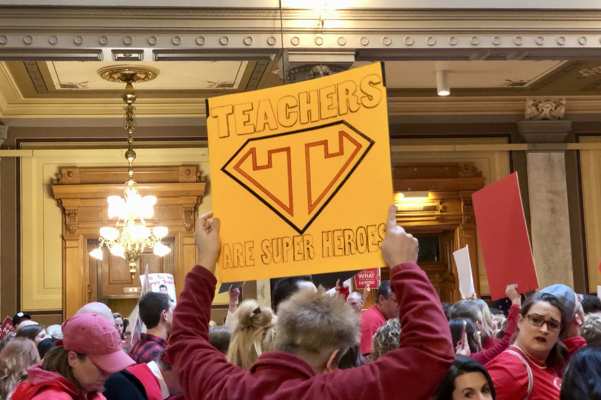 A sign raised in support of teachers at a rally held March 9, 2019 in the Statehouse.
