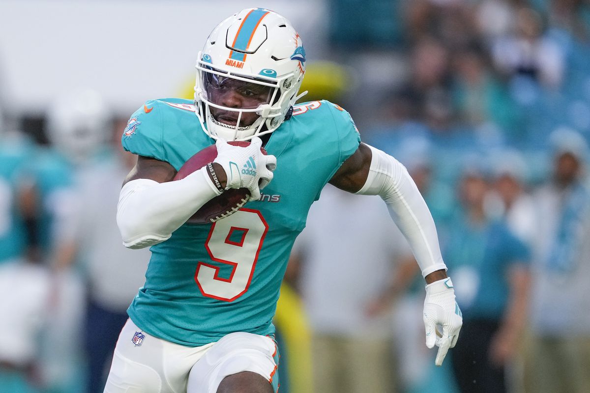 Miami Dolphins cornerback Noah Igbinoghene (9) runs with the ball for a first down during the NFL Football match between the Miami Dolphins and Atlanta Falcons on August 21, 2021 at Hard Rock Stadium in Miami, FL.