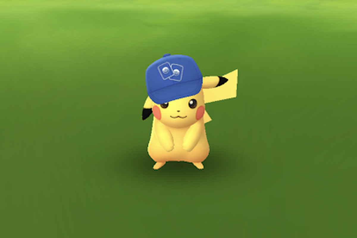 TCG Hat Pikachu on green grass