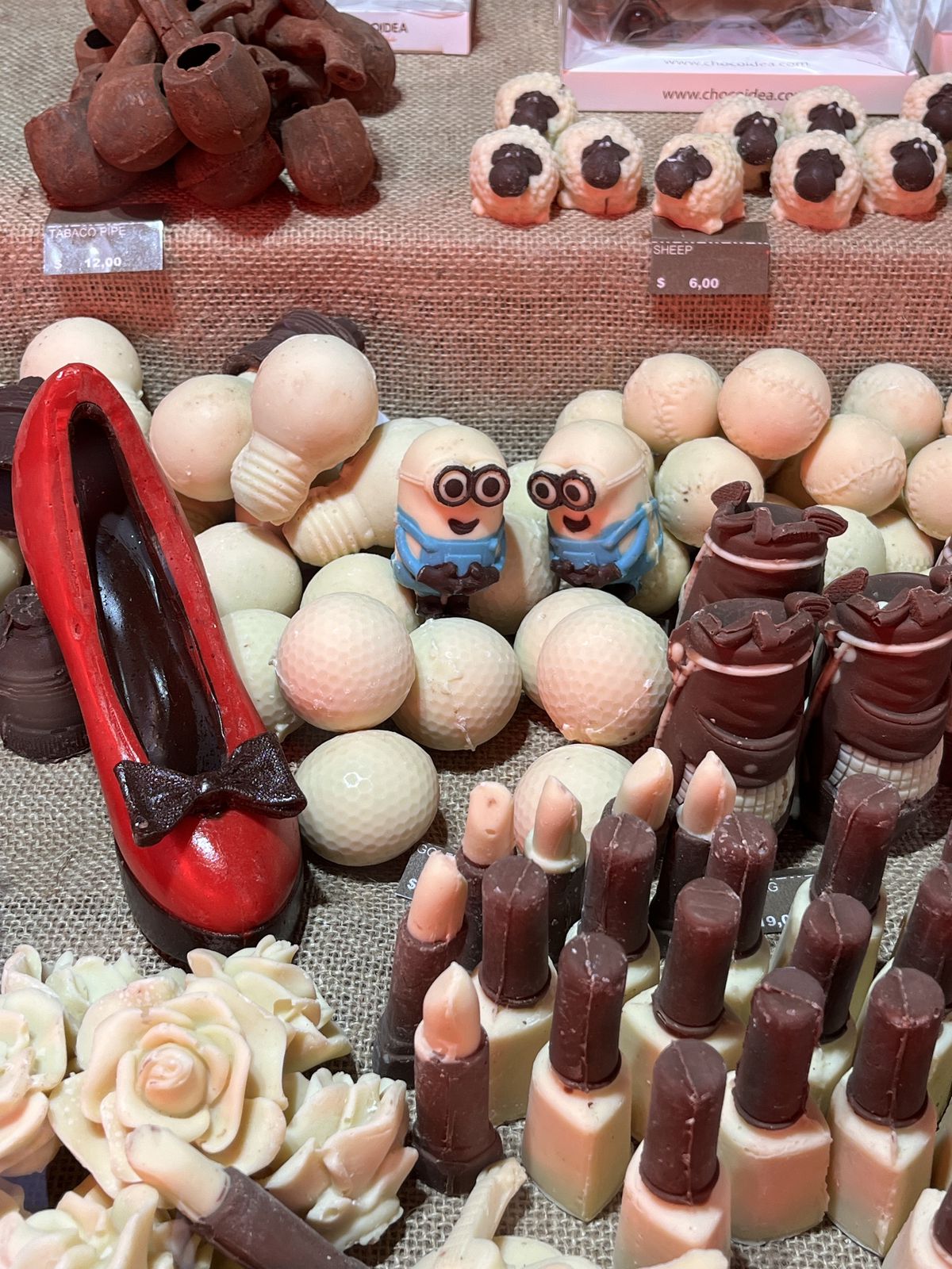A selection of chocolates shaped like golf balls, shoes, light bulbs, and Minions.