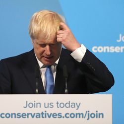 Boris Johnson scratches his head as he speaks after being announced as the new leader of the Conservative Party in London, Tuesday, July 23, 2019. Brexit champion Boris Johnson won the contest to lead Britain's governing Conservative Party on Tuesday, and will become the country's next prime minister. (AP Photo/Frank Augstein)