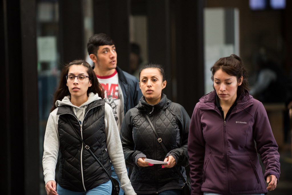Family of Rolando Ortiz, walk towards Ortiz’s bond hearing at Leighton Criminal Courthouse as Ortiz was charged with stabbing to death his two-year-old son, Mateo, this week. | Max Herman | For the Sun-Times