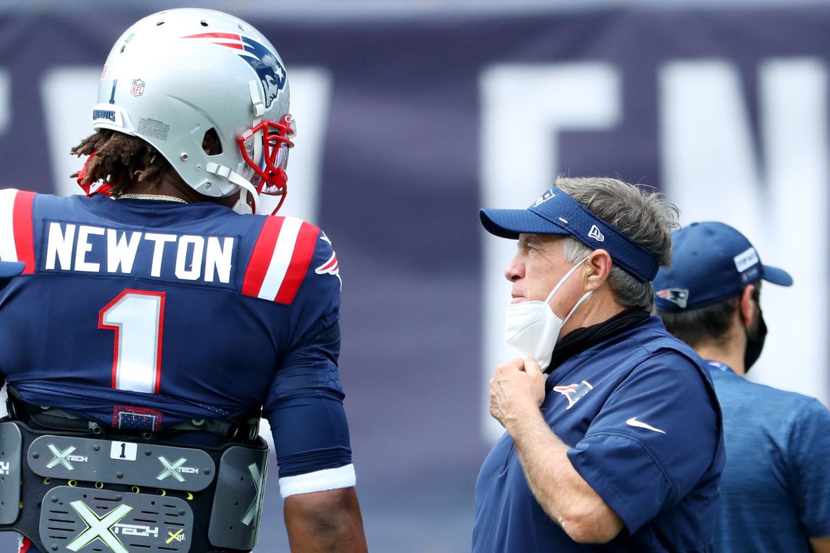 Head coach Bill Belichick of the New England Patriots talks with Cam Newton #1 before the game against the Miami Dolphins at Gillette Stadium on September 13, 2020 in Foxborough, Massachusetts.