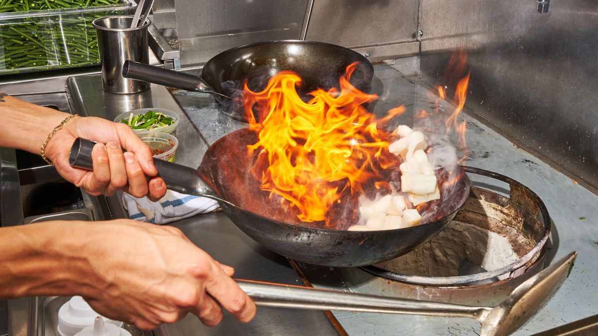 Calvin Eng, the chef and owner of Bonnie’s, tosses rolled rice noodles&nbsp;in a fiery skillet.