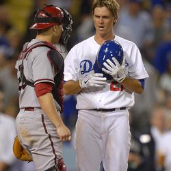 Los Angeles Dodgers' Zack Greinke, right, talks to Arizona Diamondbacks catcher Miguel Montero after he was hit by a pitch during the seventh inning of their baseball game, Tuesday, June 11, 2013, in Los Angeles.  