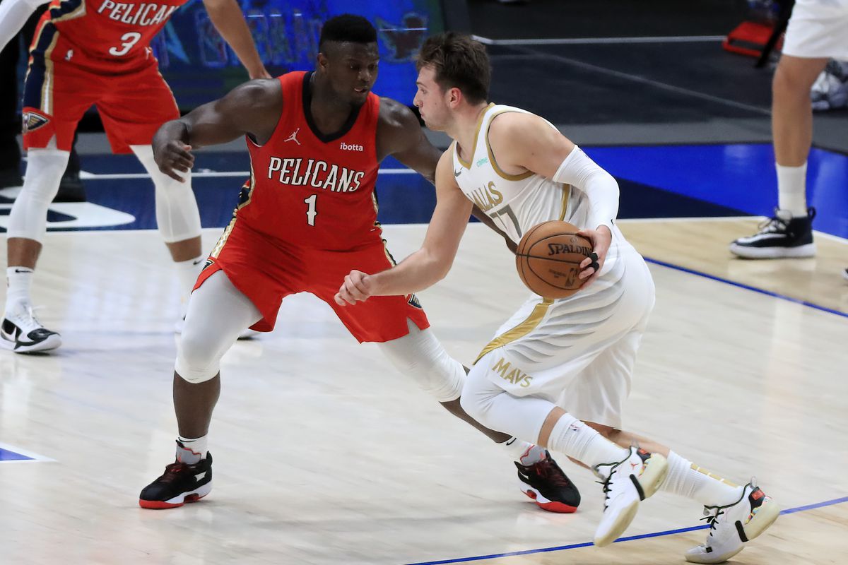 Dallas Mavericks guard Luka Doncic (77) drives to the basket as New Orleans Pelicans forward Zion Williamson (1) defends during the second half at American Airlines Center.