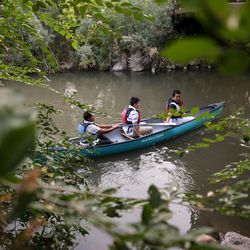 Jonathan Lopez, Axel Monjaras and Elwin Orea, all 13, set off in a canoe on the Jordan River in Salt Lake City on Thursday, Sept. 7, 2017. A group of students from Northwest Middle School and guides from Splore and National Ability Center paddled canoes up the river before school as part of the Get Into the River Festival.