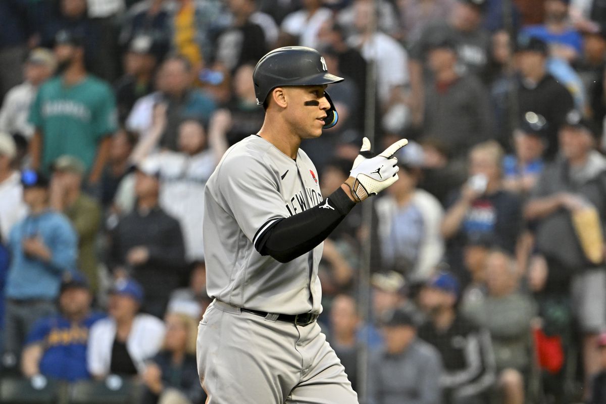 Aaron Judge of the New York Yankees gestures after hitting a one-run home run during the sixth inning against the Seattle Mariners at T-Mobile Park on May 29, 2023 in Seattle, Washington.