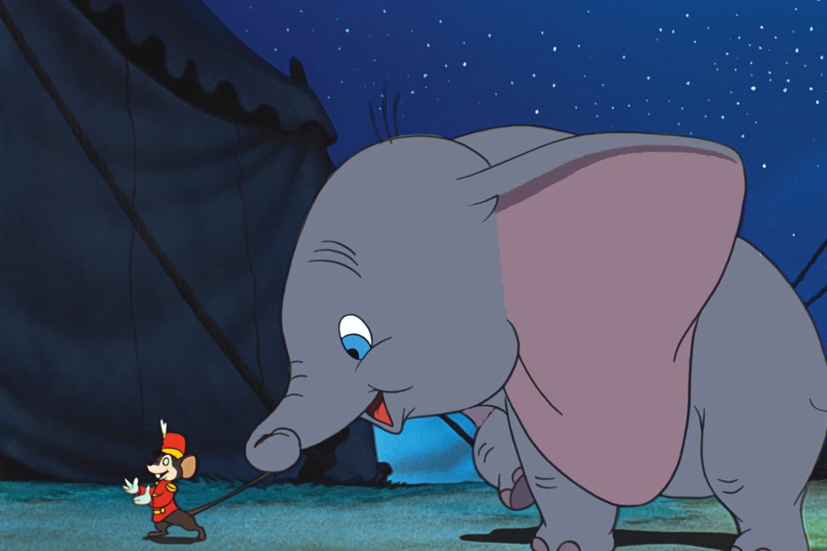 an elephant tugging on the tail of a mouse