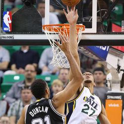 Utah Jazz center Rudy Gobert (27) blocks San Antonio Spurs forward Tim Duncan (21) as the Utah Jazz play the San Antonio Spurs in NBA basketball Monday, Feb. 23, 2015, in Salt Lake City.  
