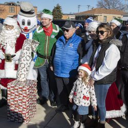 Children, along with Chicago police officers, join in Operation Santa, when Santa and Mrs. Claus — assisted by the Chicago Police Memorial Foundation — deliver gifts to the families of fallen and seriously injured officers.