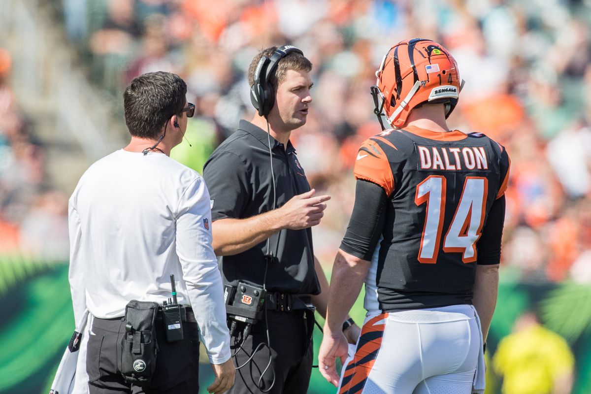 Cincinnati Bengals HC Zac Taylor talks with QB Andy Dalton during a Week 7 game against the Jacksonville Jaguars, Oct. 20, 2019.