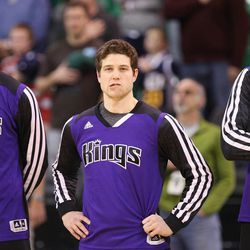 Sacramento Kings point guard Jimmer Fredette (7) stands with the Kings during the National Anthem prior to playing the Jazz  during NBA action in Salt Lake City  Saturday, Dec. 7, 2013. Jimmer and wife Whitney recently opened up about their faith and family life to a popular LDS blog site, Normons.com.