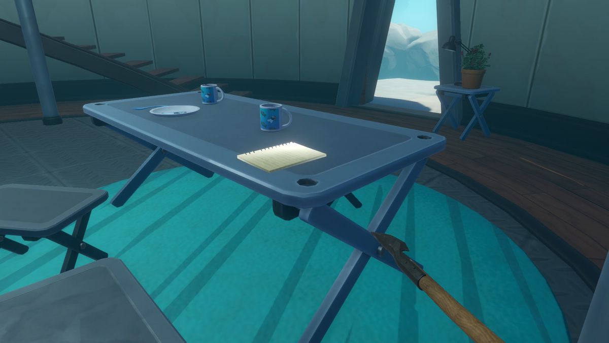 A glowing note is on a table in a snow shelter in Raft