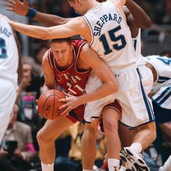 University of Utah's Britton Johnsen gets caught looking to pass around Kentucky's Jeff Sheppard during the 1998 NCAA Championship basketball game in San Antonio.