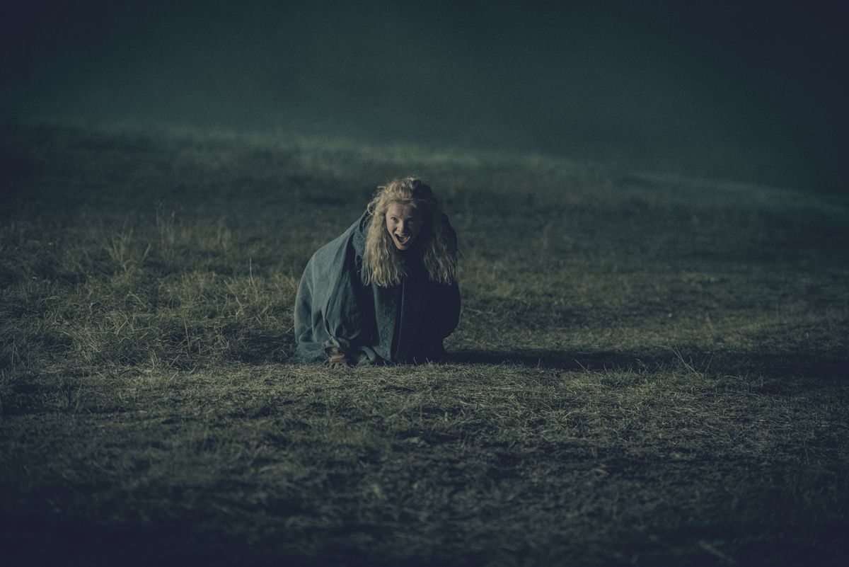 A still of Ciri in The Witcher; she’s on the ground screaming in a field