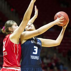 Brigham Young forward Shalae Salmon (3) shoots against Utah forward Emily Potter (12) during an NCAA women's college basketball game in Salt Lake City on Saturday, Dec. 10, 2016. Utah defeated rival Brigham Young 77-60.