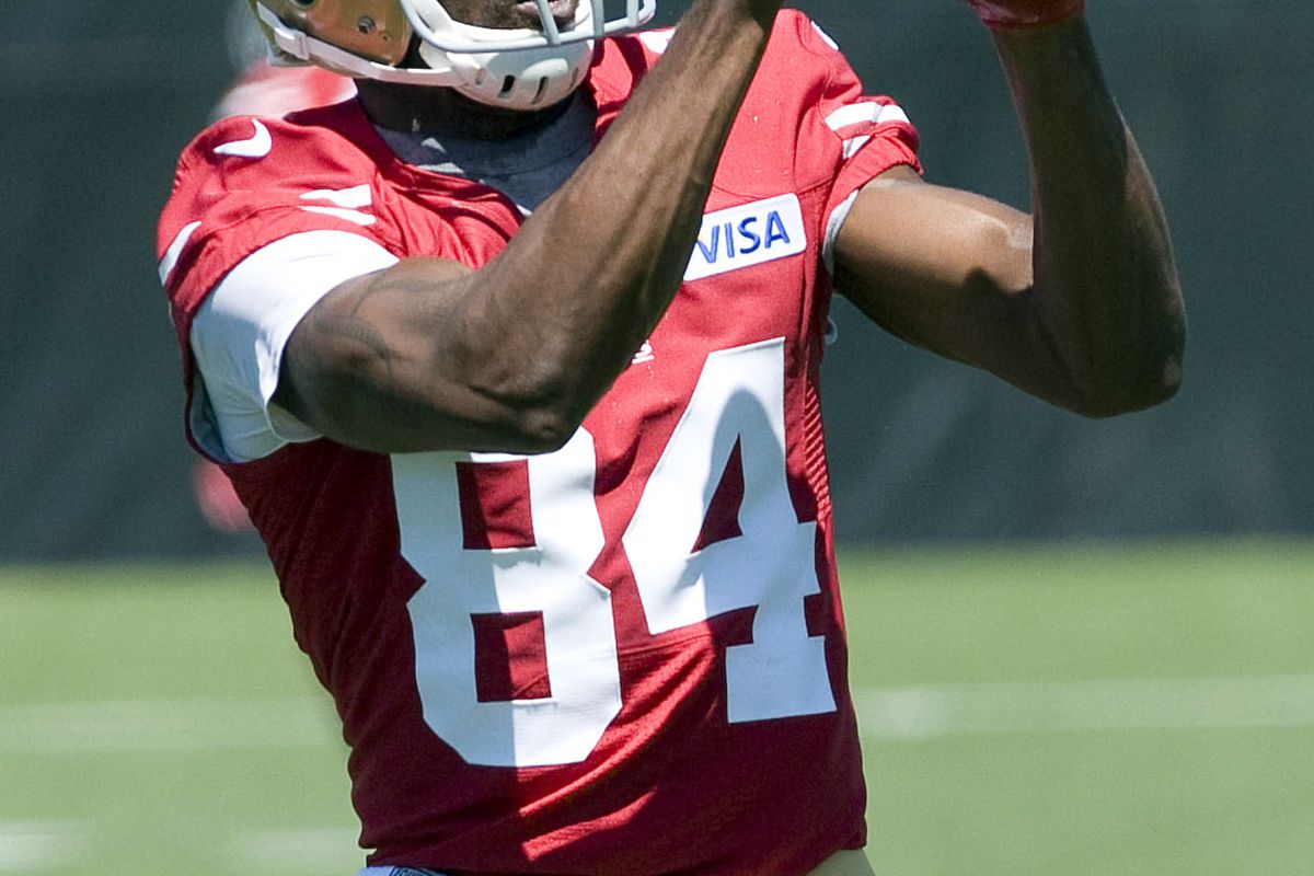 July 27, 2012; Santa Clara, CA, USA; San Francisco 49ers wide receiver Randy Moss (84) catches a pass during training camp at the 49ers practice facility.  Mandatory Credit: Ed Szczepanski-US PRESSWIRE
