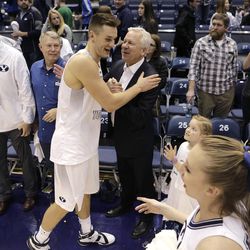 Brigham Young Cougars guard Kyle Collinsworth (5) celebrates with fans after recording his NCAA career record 11th triple-double against Portland at the Marriott Center Thursday, Feb. 25, 2016 in Provo. BYU won 99-81. 
