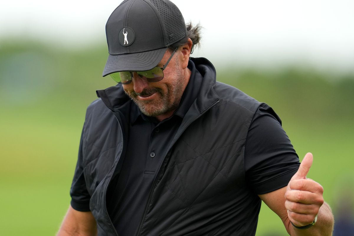 Phil Mickelson of Hy Flyers GC reacts on the 18th green following his round during day one of the LIV Golf Invitational - London at The Centurion Club on June 09, 2022 in St Albans, England.