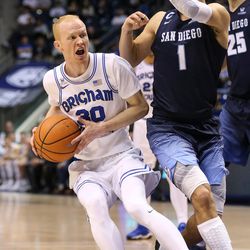 Brigham Young Cougars guard TJ Haws (30) drives against San Diego Toreros guard Tyler Williams (1) at the Marriott Center in Provo on Saturday, Jan. 20, 2018.
