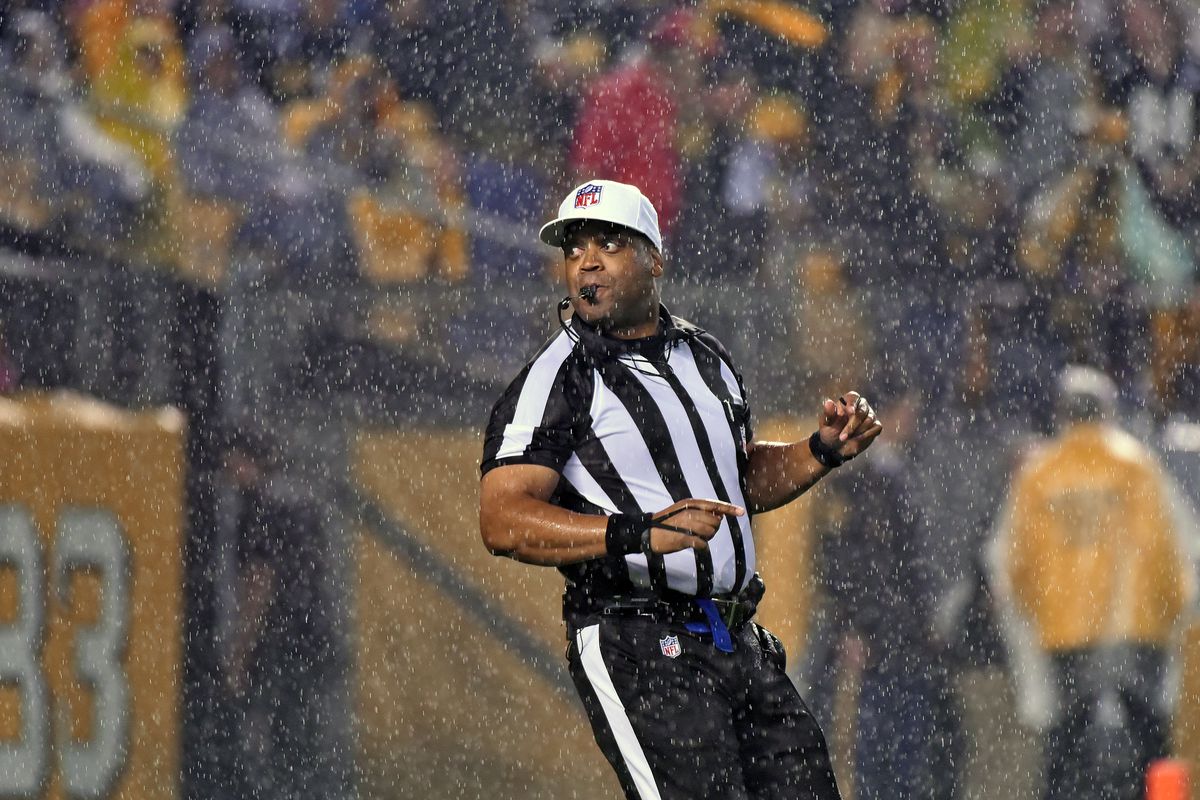 National Football League referee Ron Torbert looks on from the field as rain falls during a game between the Kansas City Chiefs and Pittsburgh Steelers at Heinz Field on October 2, 2016 in Pittsburgh, Pennsylvania.