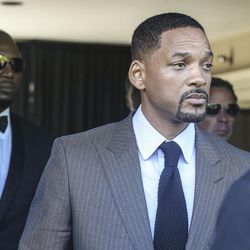 Actor Will Smith, center, departs the funeral home, Tuesday, June 10, 2016, in Louisville, Ky., before Muhammad Ali's memorial service. Smith was  a pall bearer for Ali. 
