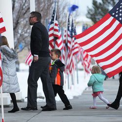 A family arrives for the viewing of United police officer Doug Barney in West Valley City on Sunday, Jan. 24, 2016. Barney was shot and killed by Cory Lee Henderson while responding to a car crash that Henderson had just fled from on Sunday, Jan. 17, 2016. Henderson was shot multiple times by pursuing officers whom he also fired on.