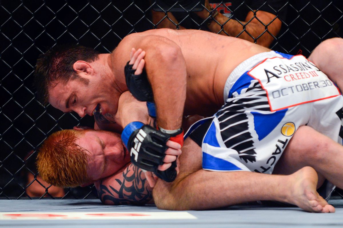 August 11, 2012; Denver, CO, USA; Jake Shields (top) fights Ed Herman (bottom) during UFC 150 at the Pepsi Center. Mandatory Credit: Ron Chenoy-US PRESSWIRE
