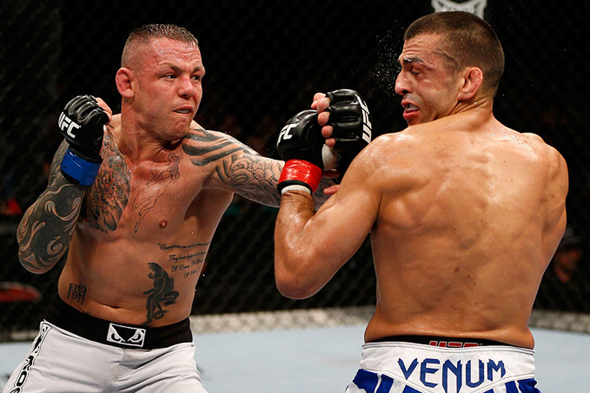Ross Pearson (left) lands a punch against George Sotiropoulos (right) in the main event of UFC on FX