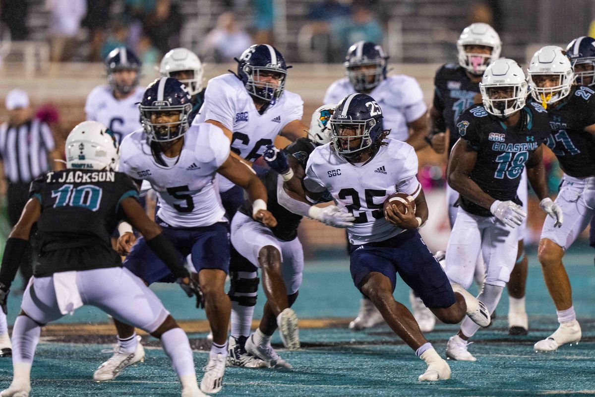 Georgia Southern Eagles running back Jalen White runs the ball against the Coastal Carolina Chanticleers in the fourth quarter at Brooks Stadium.