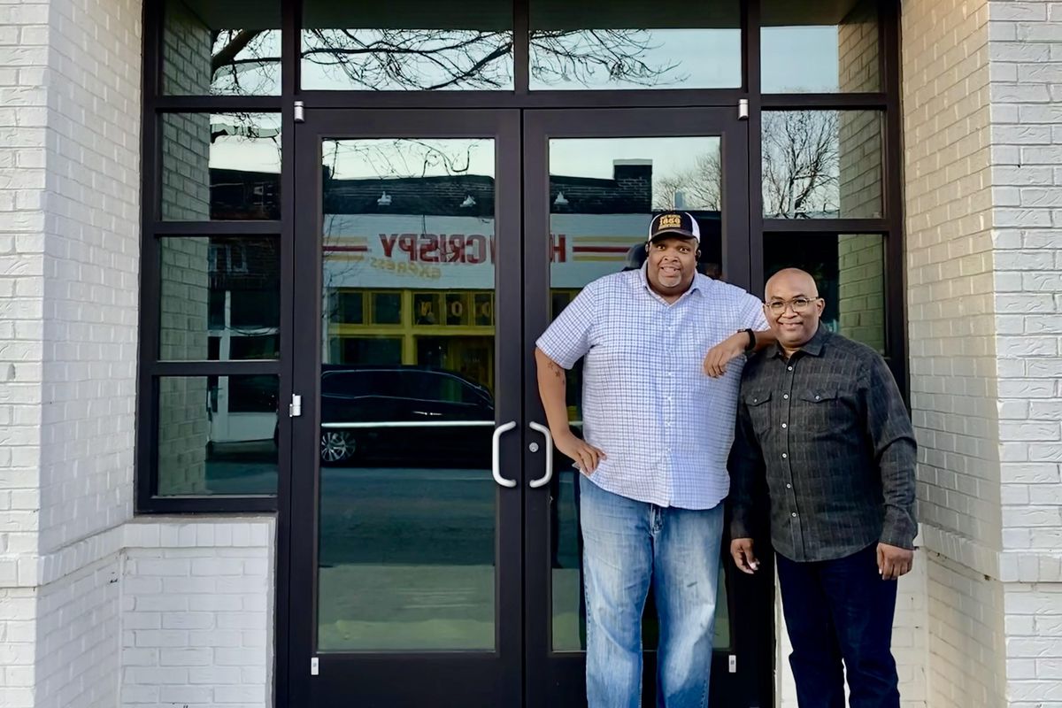 Chef Duane Nutter and Reginald “Reggie” Washington standing at the front door of their forthcoming location of Southern National in Summerhill, Atlanta.