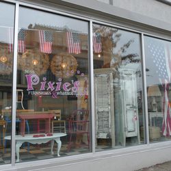 Flags decorate the storefront at beloved 14th Street furniture shop <a href="http://www.misspixies.com/">Miss Pixie's.</a>