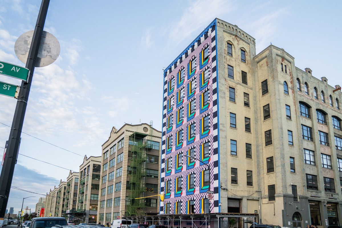 Camille Walala’s completed permanent mural on a seven-story building at Industry City in Sunset Park, Brooklyn. 