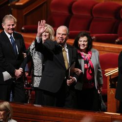 Elder Ronald A. Rasband, of the LDS Church’s Quorum of the Twelve Apostles, waves as he and his wife, Melanie, and other members of the Twelve and their wives exit the Conference Center in Salt Lake City at the end of the morning session of the LDS Church’s 187th Annual General Conference on Sunday, April 2, 2017.
