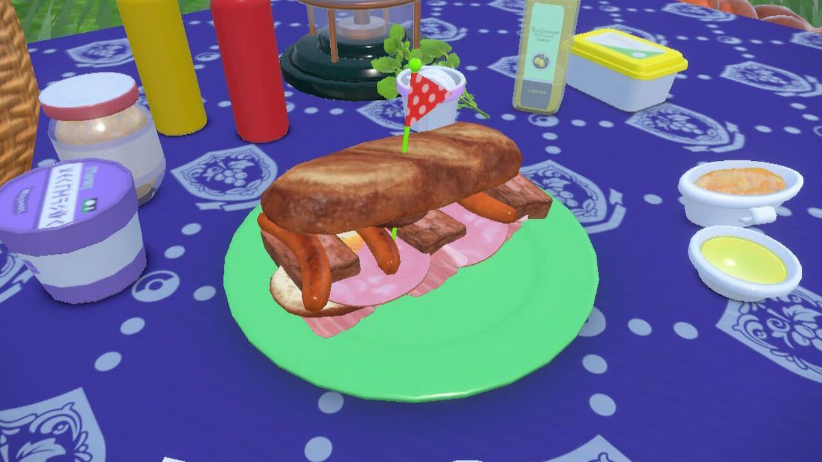 Pokémon Scarlet and Violet’s stacked sandwich on a blue tablecloth