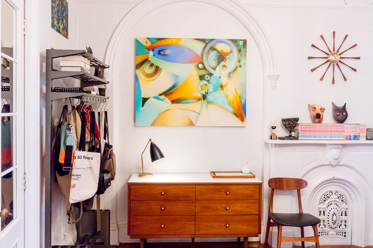 Vintage finds in the eclectic Brooklyn apartment of a Design Within Reach buyer includes a thrifted coat rack.