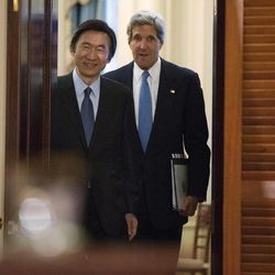 U.S. Secretary of State John Kerry, right, enters a news conference with South Korean Foreign Minister Yun Byung-Se, at the State Department in Washington, on Tuesday, April 2, 2013. 