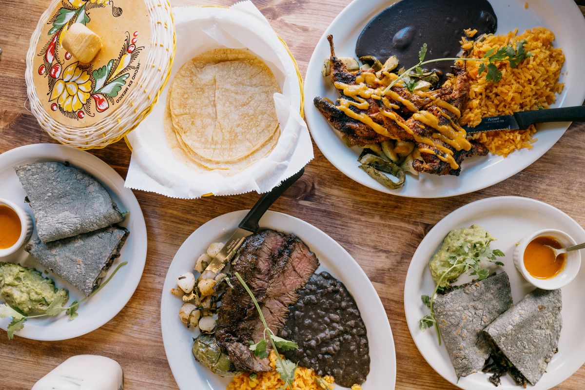 A table filled with plates of Oaxacan food.