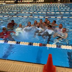 Judge Memorial’s swimmers and coaches take a plunge into the South Davis Rec Center pool to celebrate their 3A state championship on Saturday.