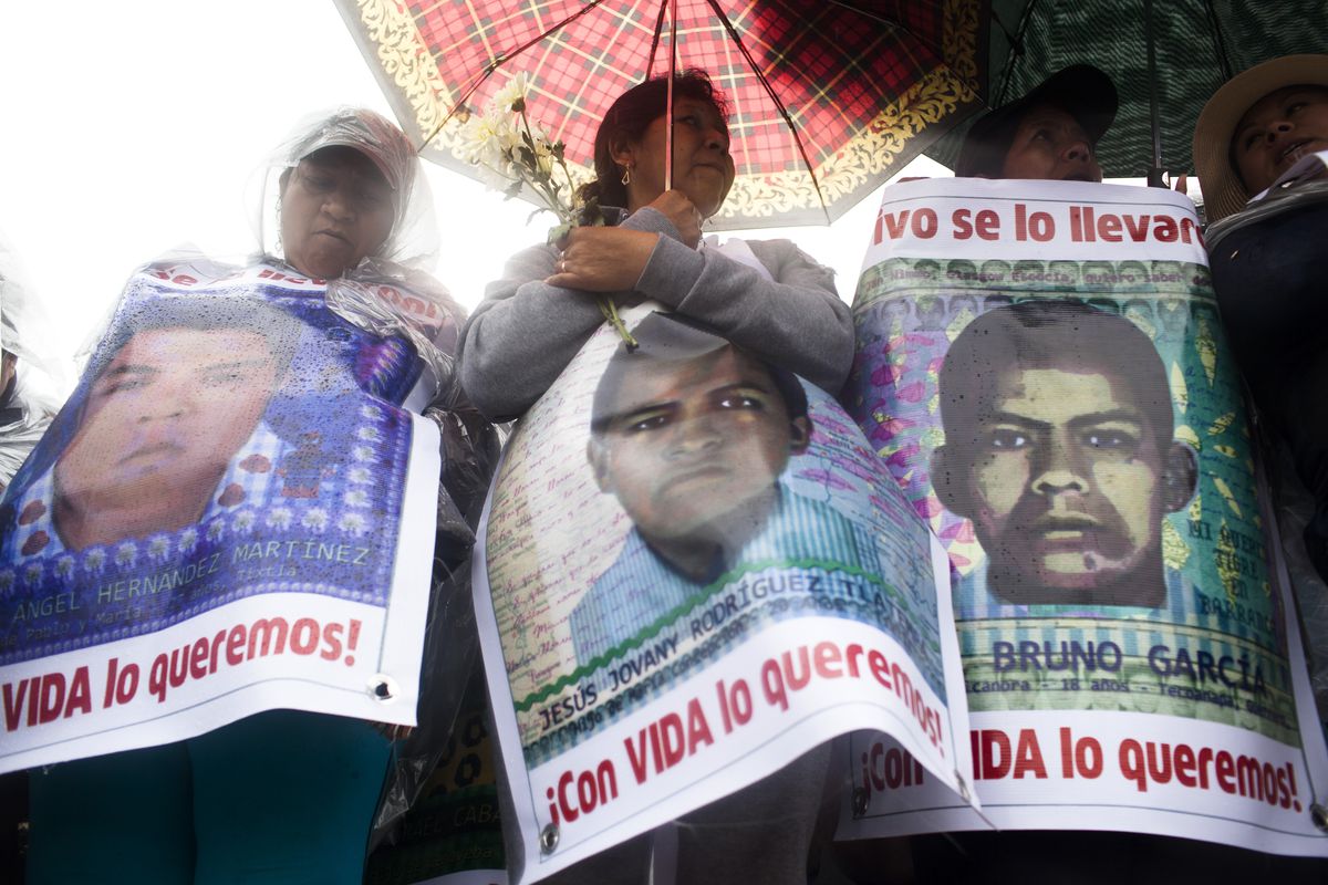 Protest In Mexico City Marks One Year Anniversary Of Missing Students
