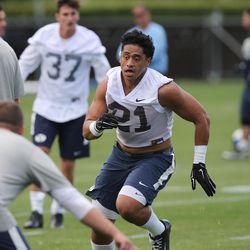 Linebacker Harvey Langi runs through drills as BYU opens their first day of football camp Aug. 8, 2015, in Provo.
