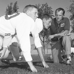 Granite High head football coach LaVell Edwards poses with players August 1960.