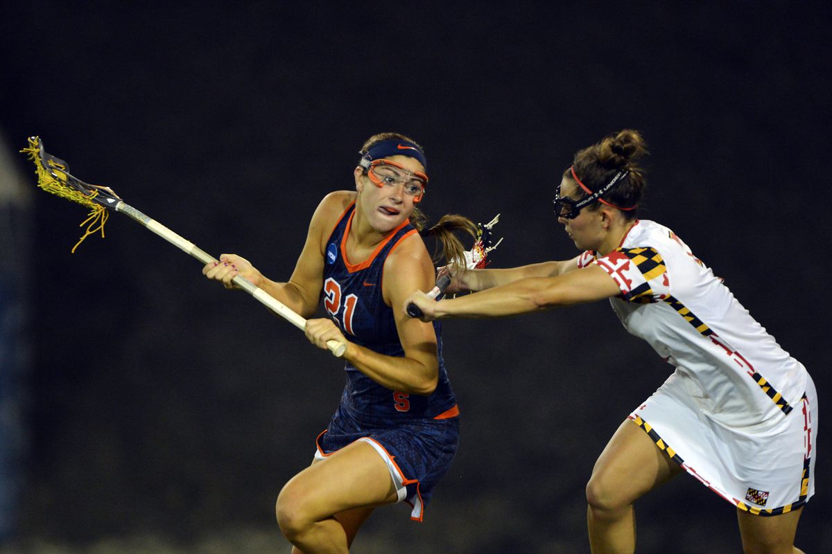 Kayla Treanor holds off a defender in the NCAA WLAX Championship