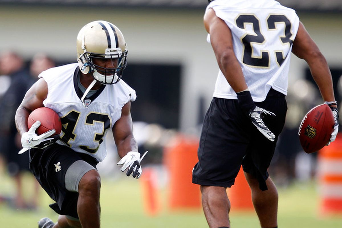 METAIRIE, LA - MAY 24:  Darren Sproles #43 of the New Orleans Saints practices during OTA's with teammate Pierre Thomas #23 at the Saints Training Facility on May 24, 2012 in Metairie, Louisiana.  (Photo by Sean Gardner/Getty Images)