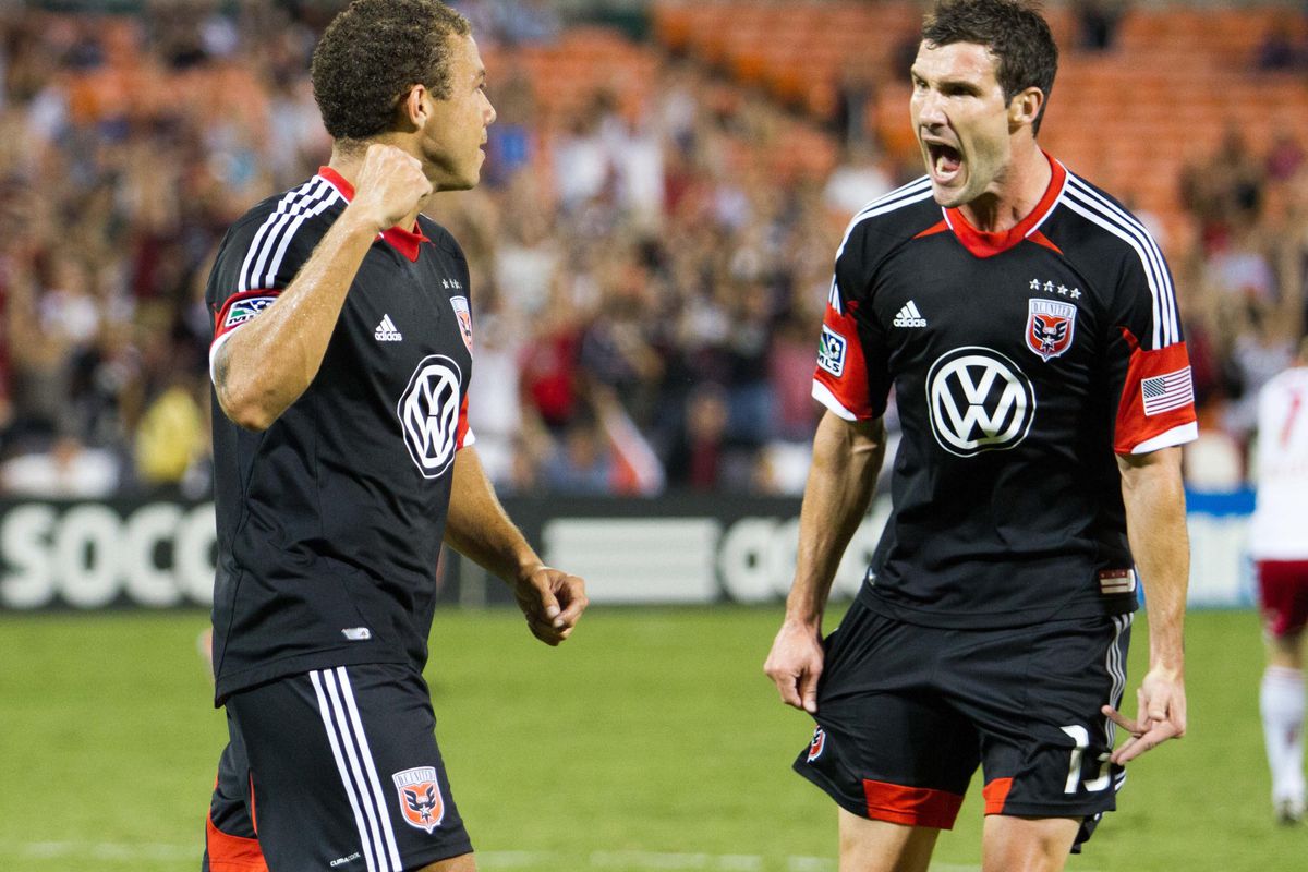 Aug 29, 2012; Washington, DC, USA; DC United midfielder Nick DeLeon (18) and midfielder Chris Pontius (13) celebrate after a goal against New York Red Bulls during the first half at RFK Stadium.  Mandatory Credit: Paul Frederiksen-US PRESSWIRE