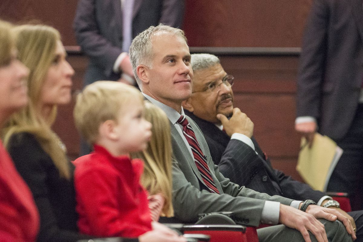 New Maryland football coach D.J. Durkin sits with his family and Terrapins athletic director Kevin Anderson at a Thursday press conference.